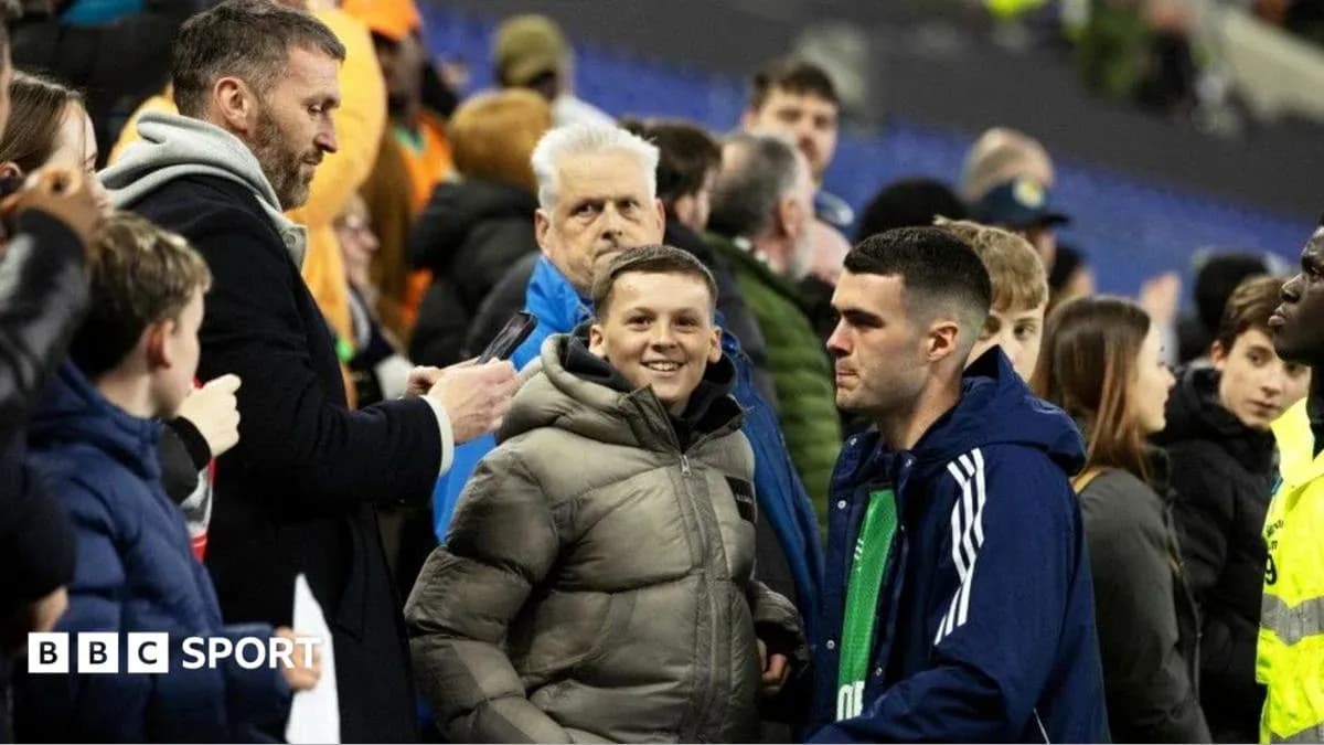 Fans interacting in the stands after the match