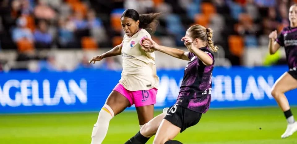 Player tackling during San Diego Wave vs Orlando Pride match