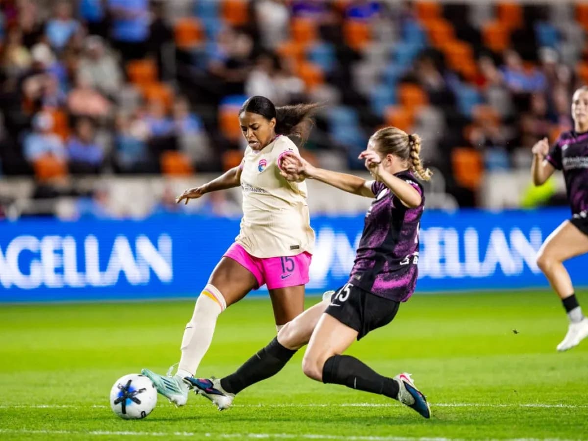Player tackling during San Diego Wave vs Orlando Pride match
