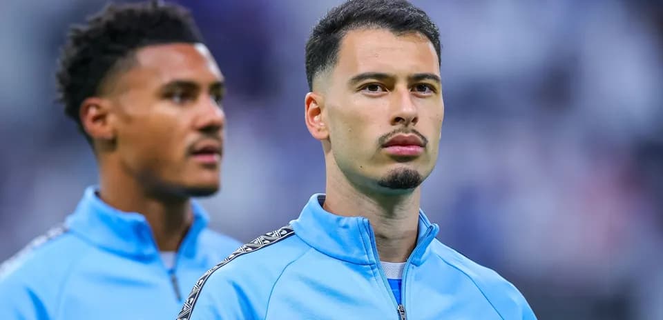 Two players in blue team jackets before match