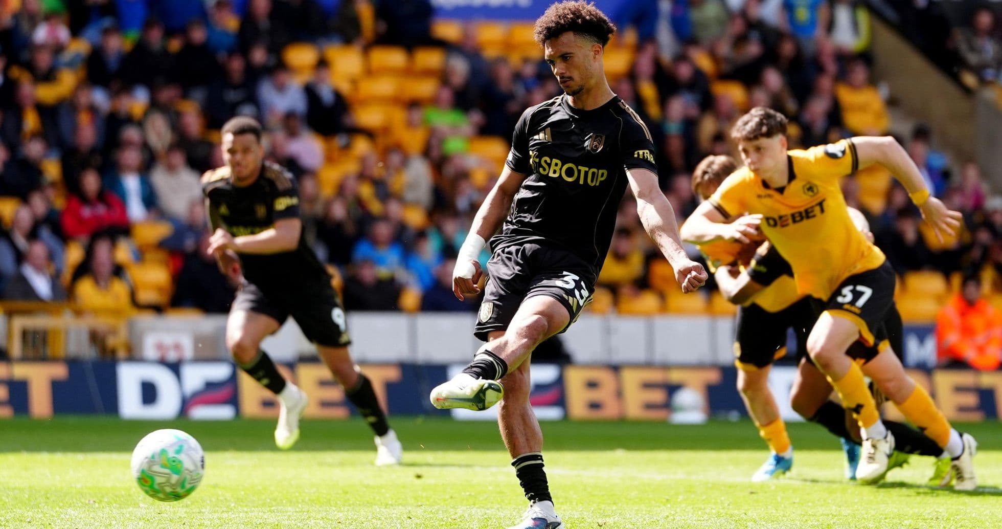 Player taking a penalty kick for Wolves