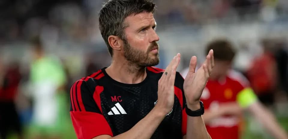 Coach applauding after match on the sidelines