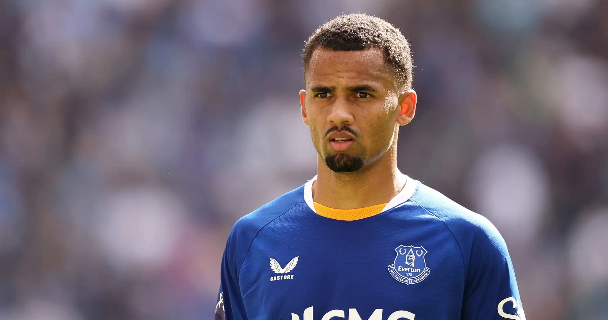 Everton player standing on the pitch during match