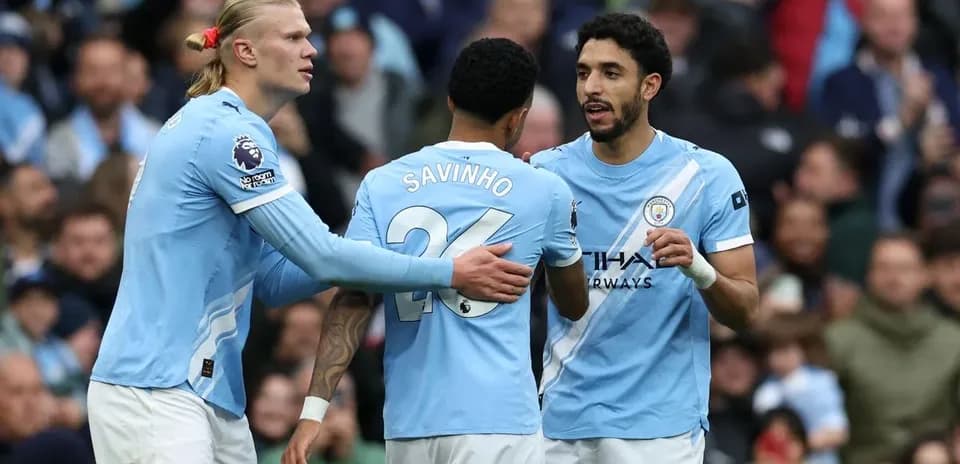Manchester City players celebrating during a match