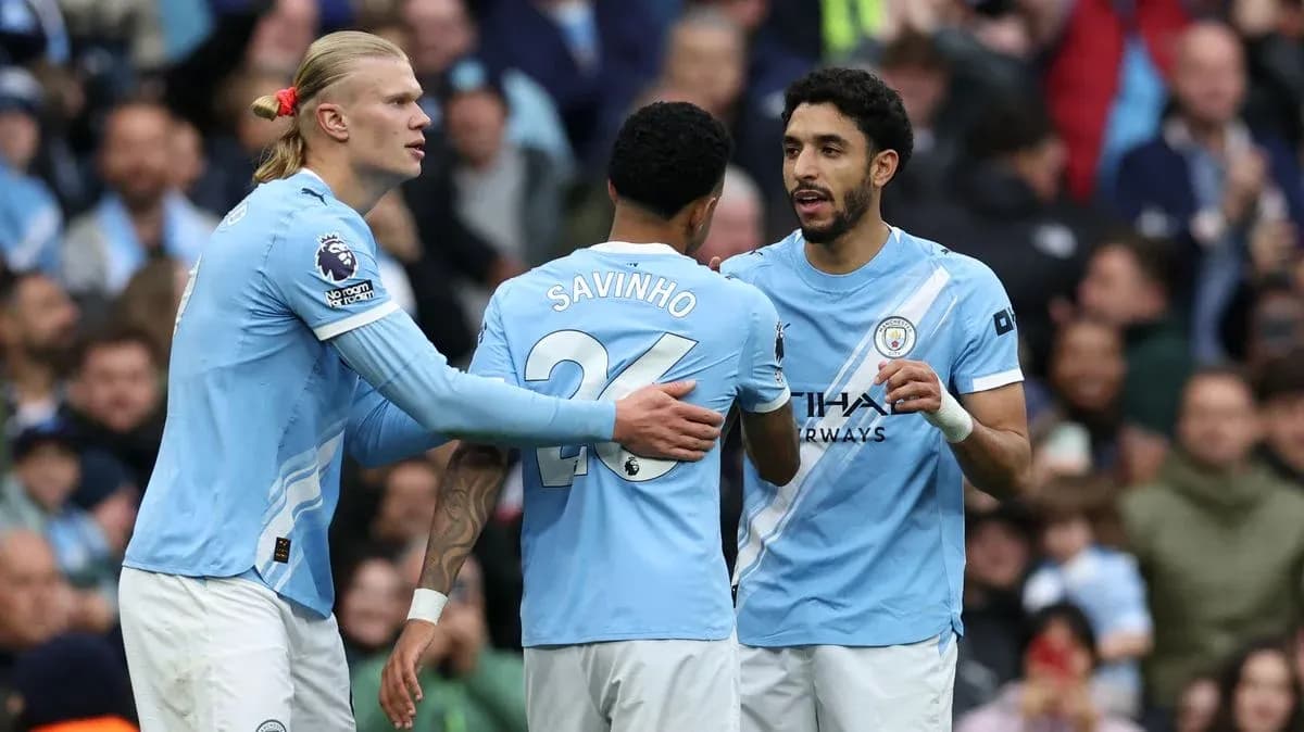 Manchester City players celebrating during a match