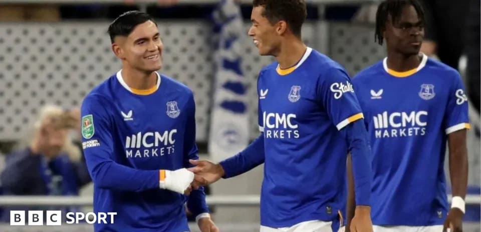 Two Everton players celebrating during a match
