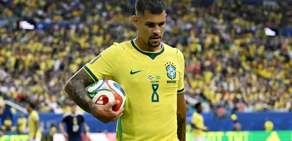 Brazilian player holding the ball during match