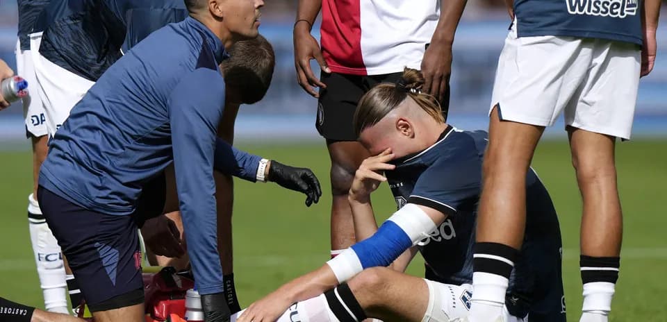 Player receiving medical attention on the field
