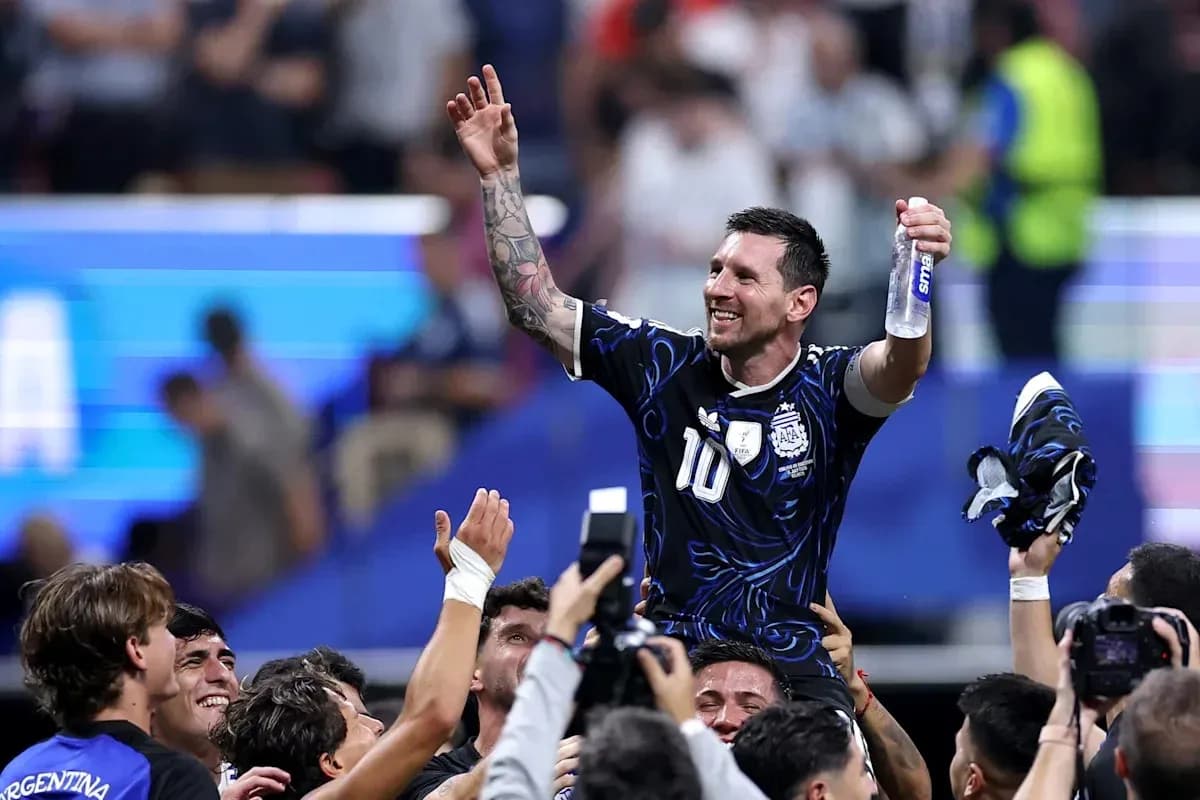 Player being celebrated by teammates after victory