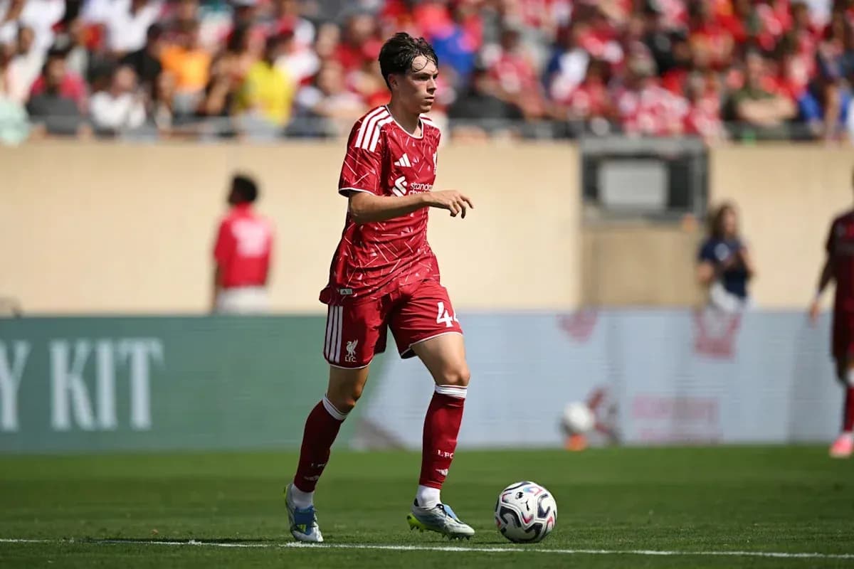 Liverpool player dribbling ball during match