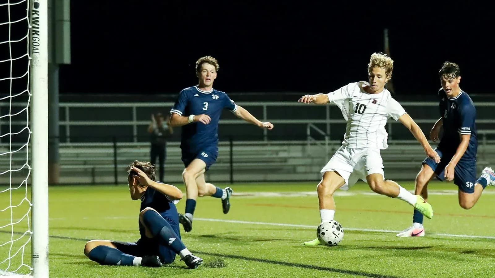 Player shooting on goal during soccer match