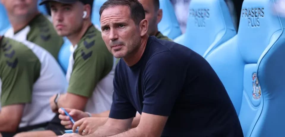 Coach sitting on bench during a match