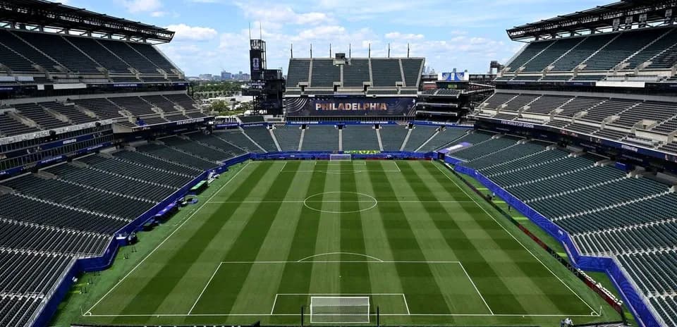 Empty stadium with soccer field and stands