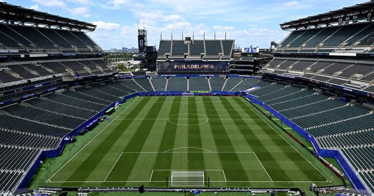 Empty stadium with soccer field and stands