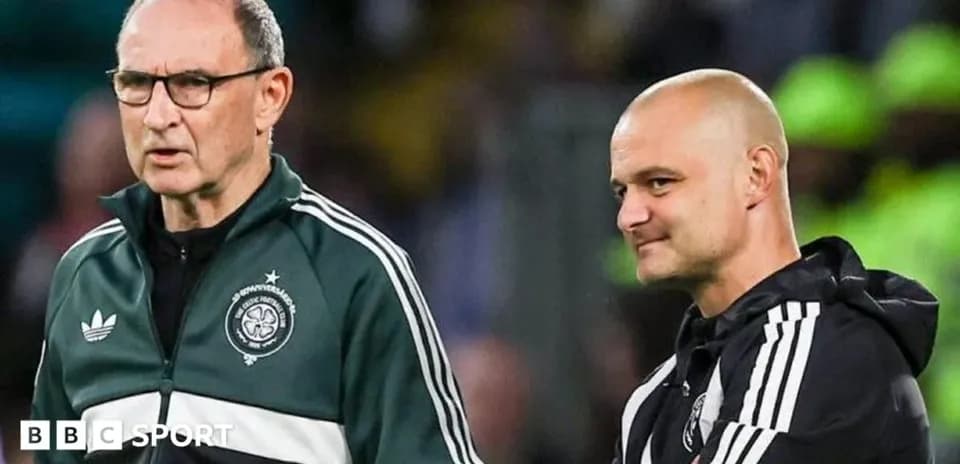 Two coaches discussing strategy during a match