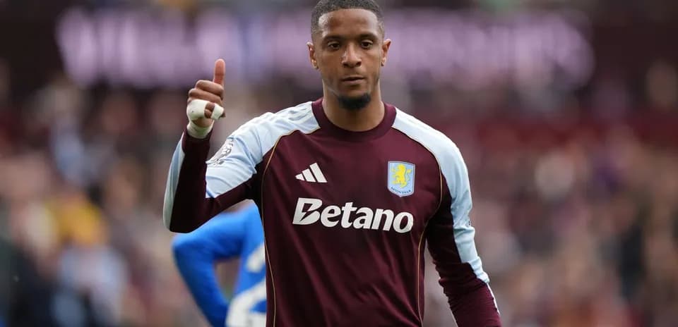 Goalkeeper signaling during a match for Aston Villa