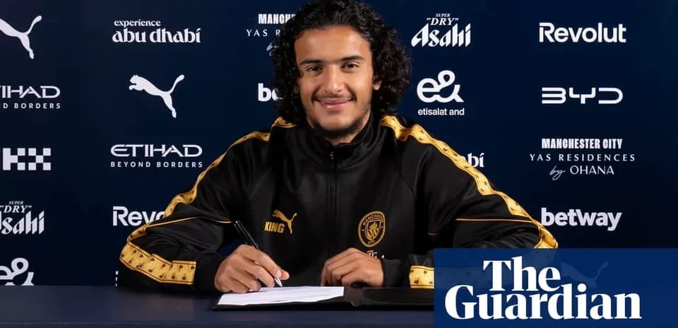 Player signing contract at Manchester City press event