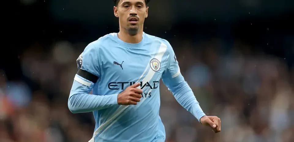 Player running in Manchester City kit during match