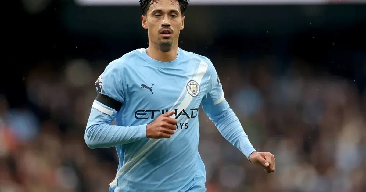 Player running in Manchester City kit during match
