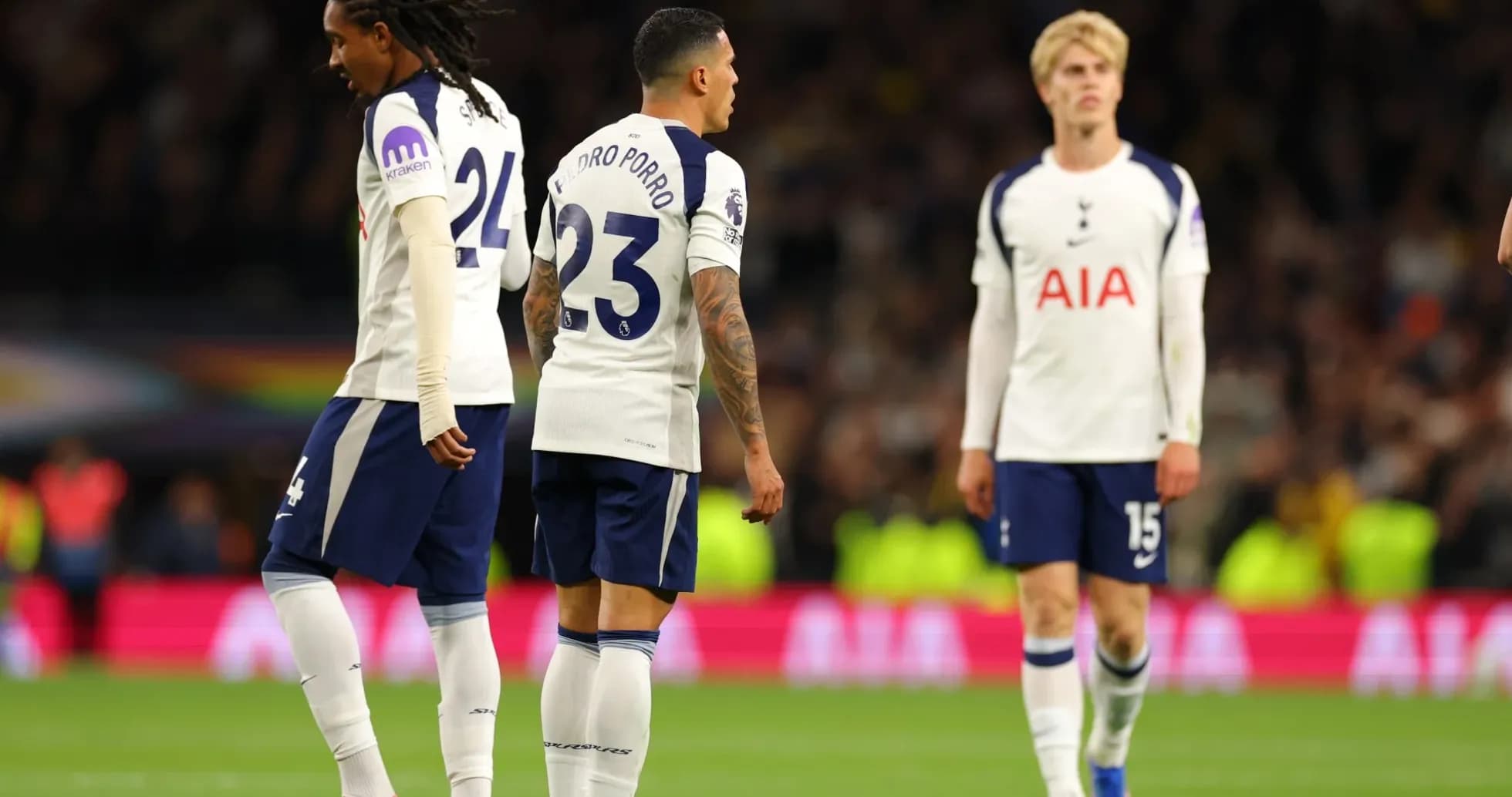 Tottenham players walking on the pitch during match