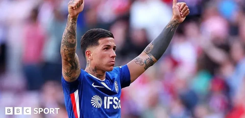 Player celebrating with thumbs up in stadium