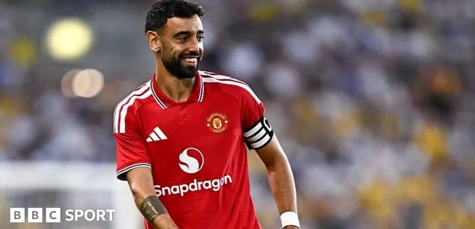 Bruno Fernandes smiling in Manchester United kit