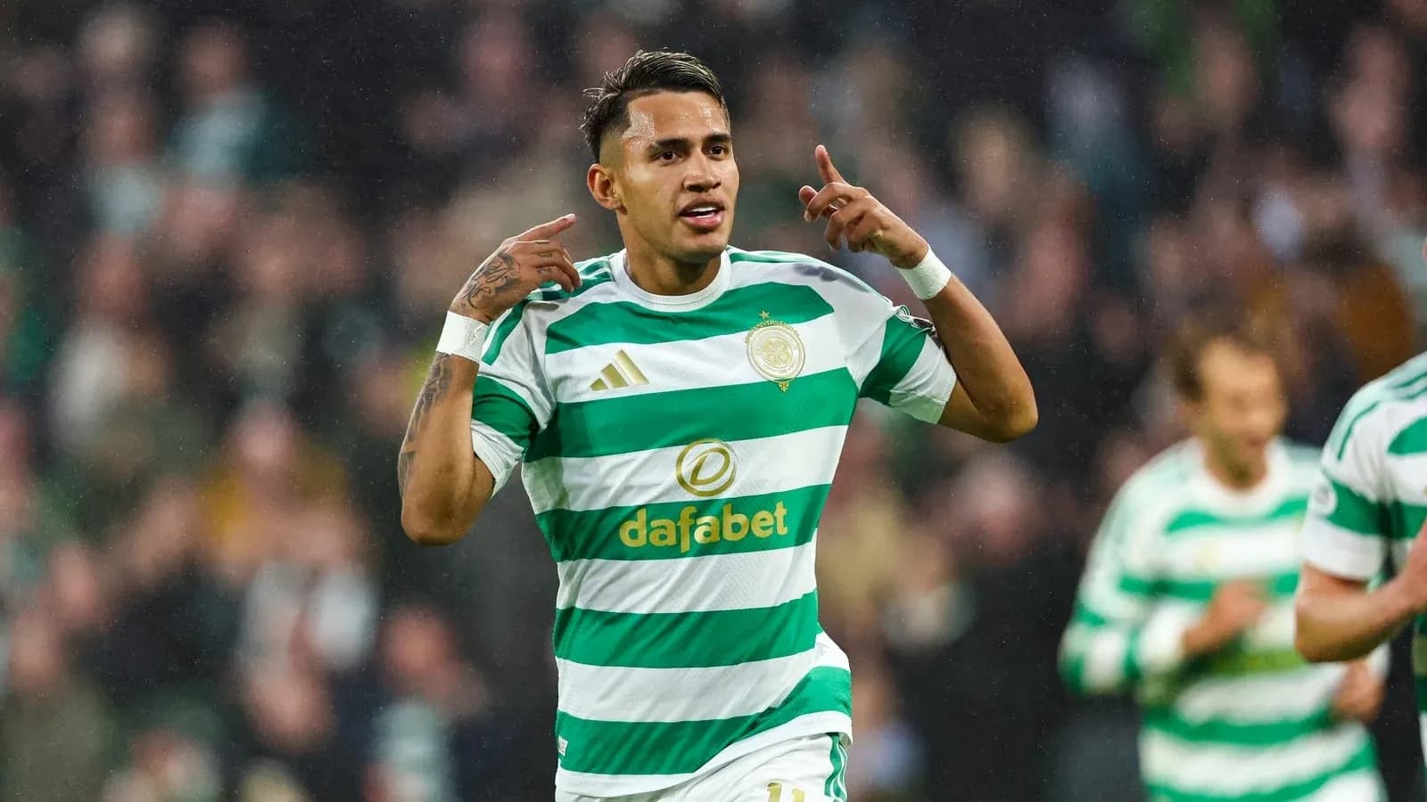 Player celebrating a goal in Celtic jersey