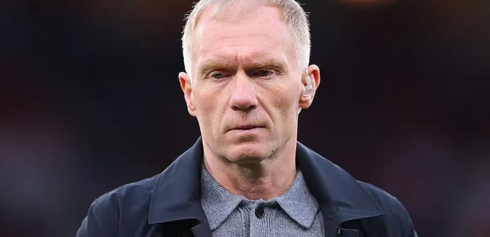 Man in a coat during a sporting event