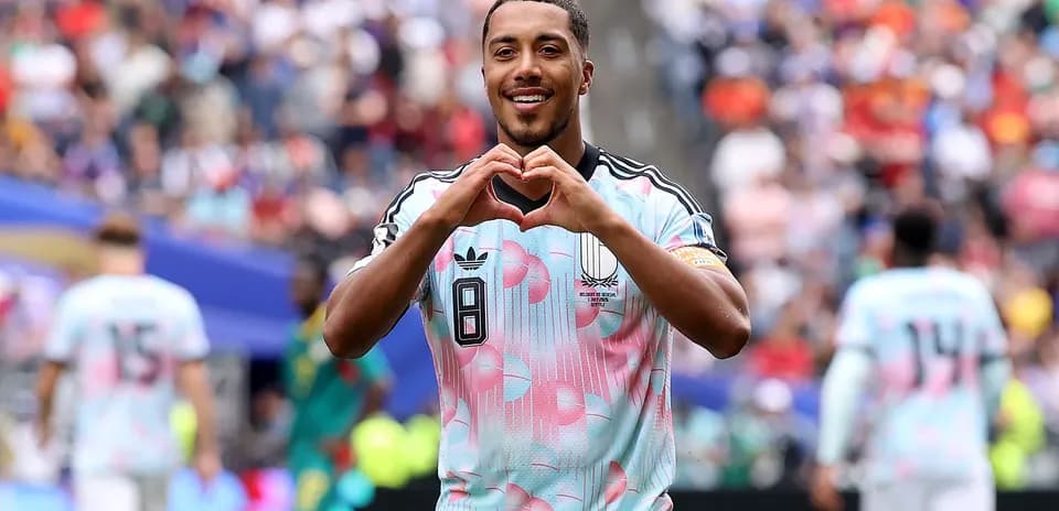 Player celebrating by making heart shape gesture