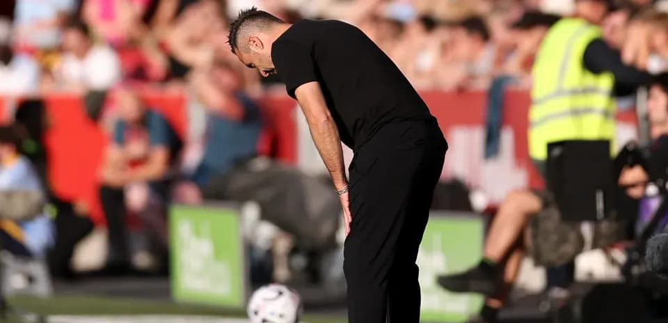 Coach observing the game with a focused stance