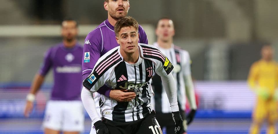 Juventus player engaged with Fiorentina opponent