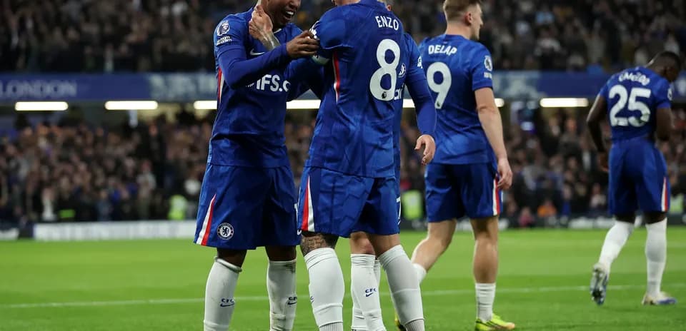 Chelsea players celebrating during Premier League match