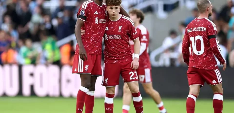 Liverpool players discussing on the pitch during match