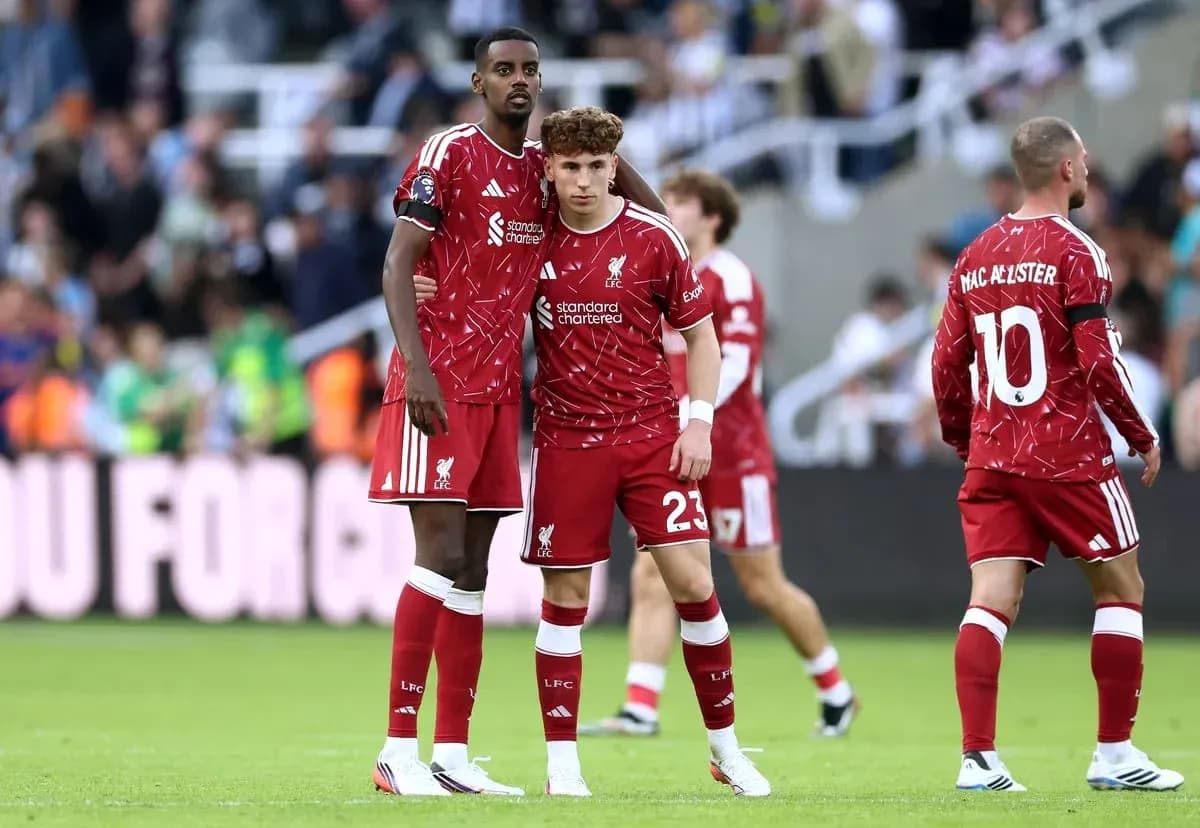Liverpool players discussing on the pitch during match