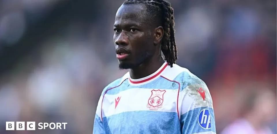Player wearing striped jersey during match