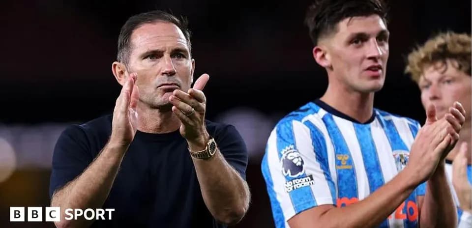 Manager and player applauding fans after match