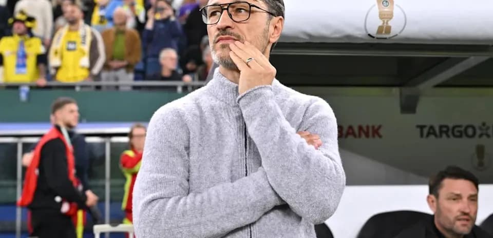 Coach observing the match from the sideline