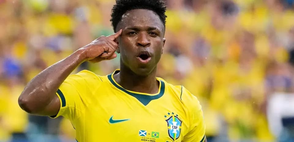 Player celebrating with hand gesture in Brazil jersey