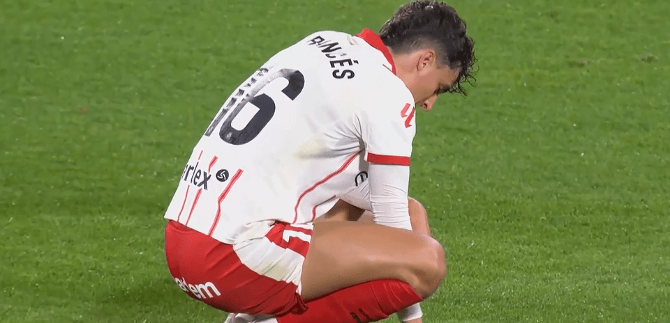 Girona player kneeling on the pitch during match