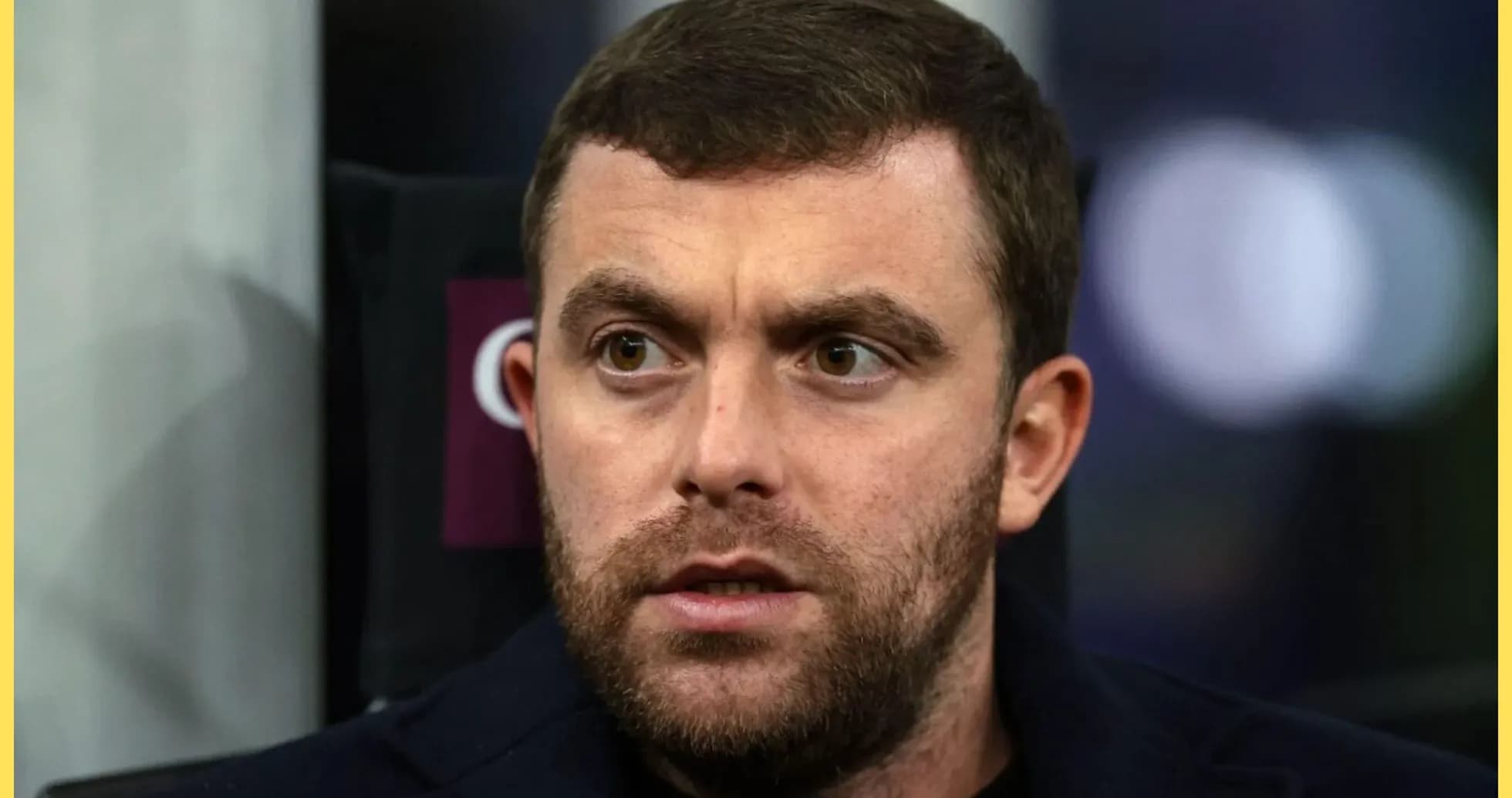 Close-up of a man with a beard looking serious
