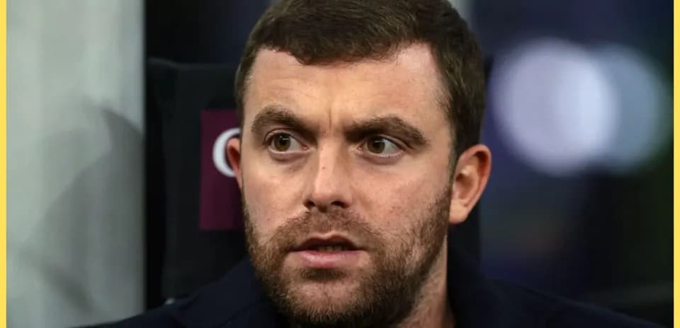 Close-up of a man with a beard looking serious