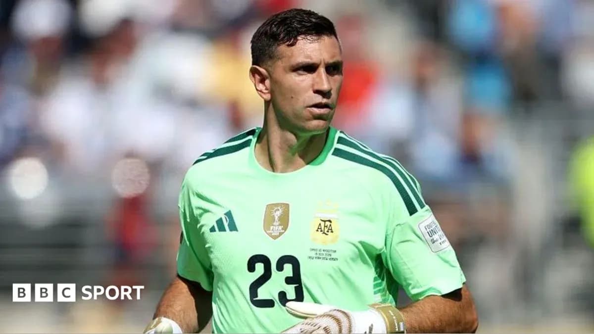 Goalkeeper in green kit preparing for match
