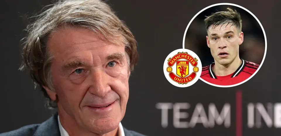 Man speaking at event with Manchester United logo