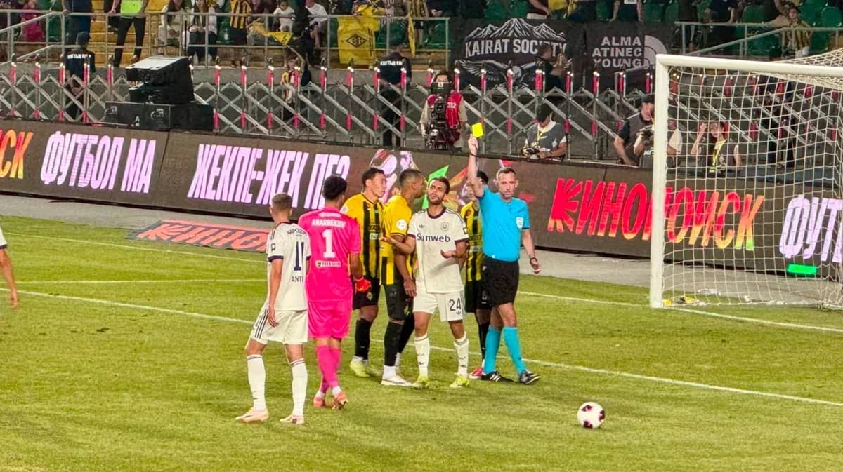Players discussing after yellow card shown