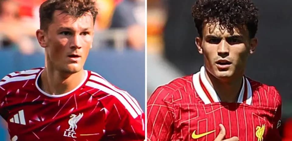 Two Liverpool players in red kits during match