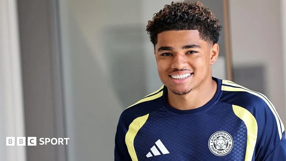 Football player smiling in Leicester City training kit