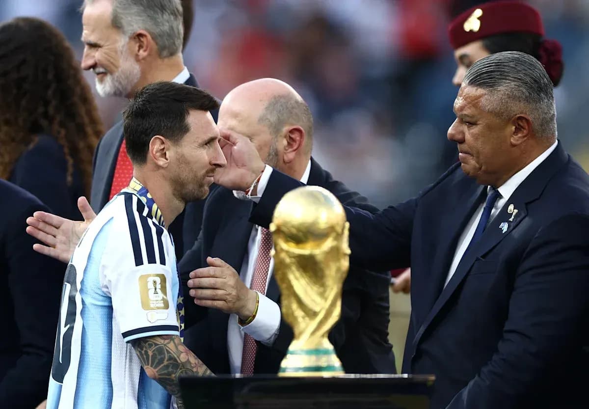 Lionel Messi receiving trophy after match ceremony