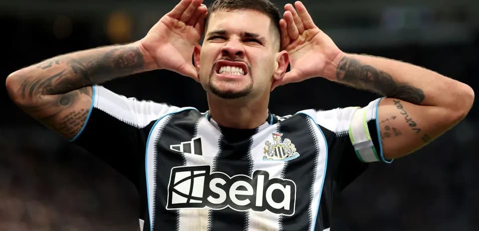 Player celebrating with hands on ears in stadium