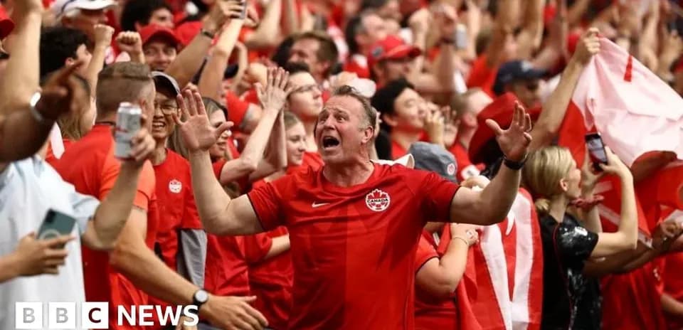 Fans celebrating in red at a sporting event