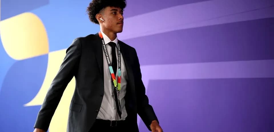 Player walking in formal attire at event